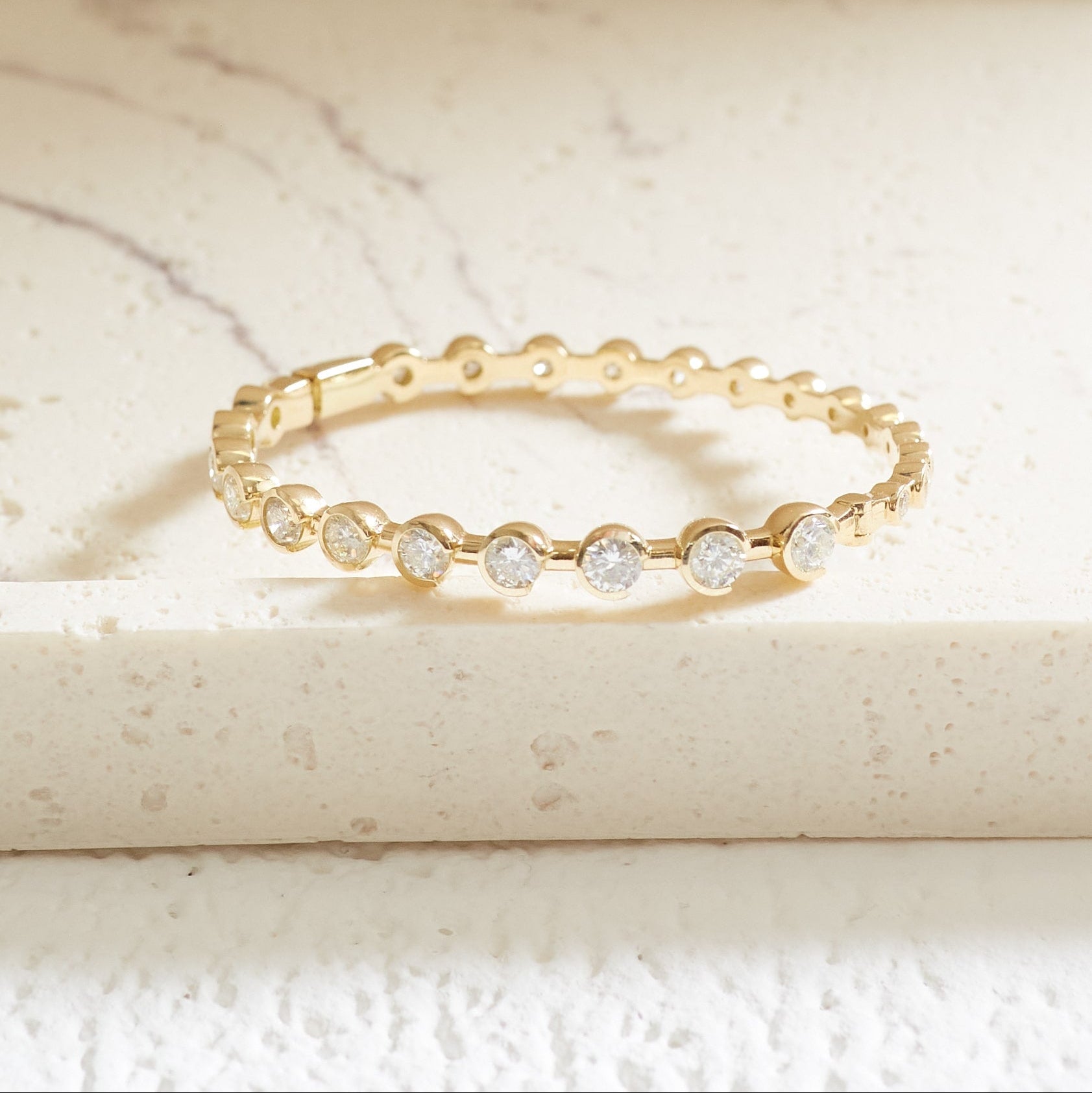 Semi-Bezel graduated Diamond bangle