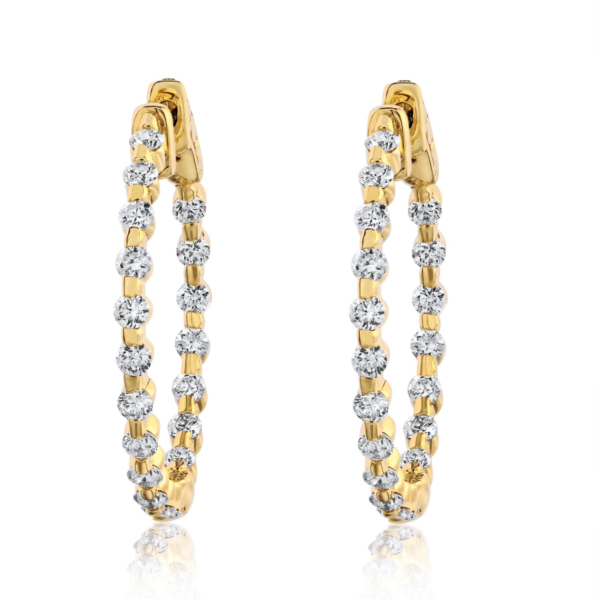 A pair of 14K gold diamond hoop earrings with a shared prong setting, displaying round diamonds.