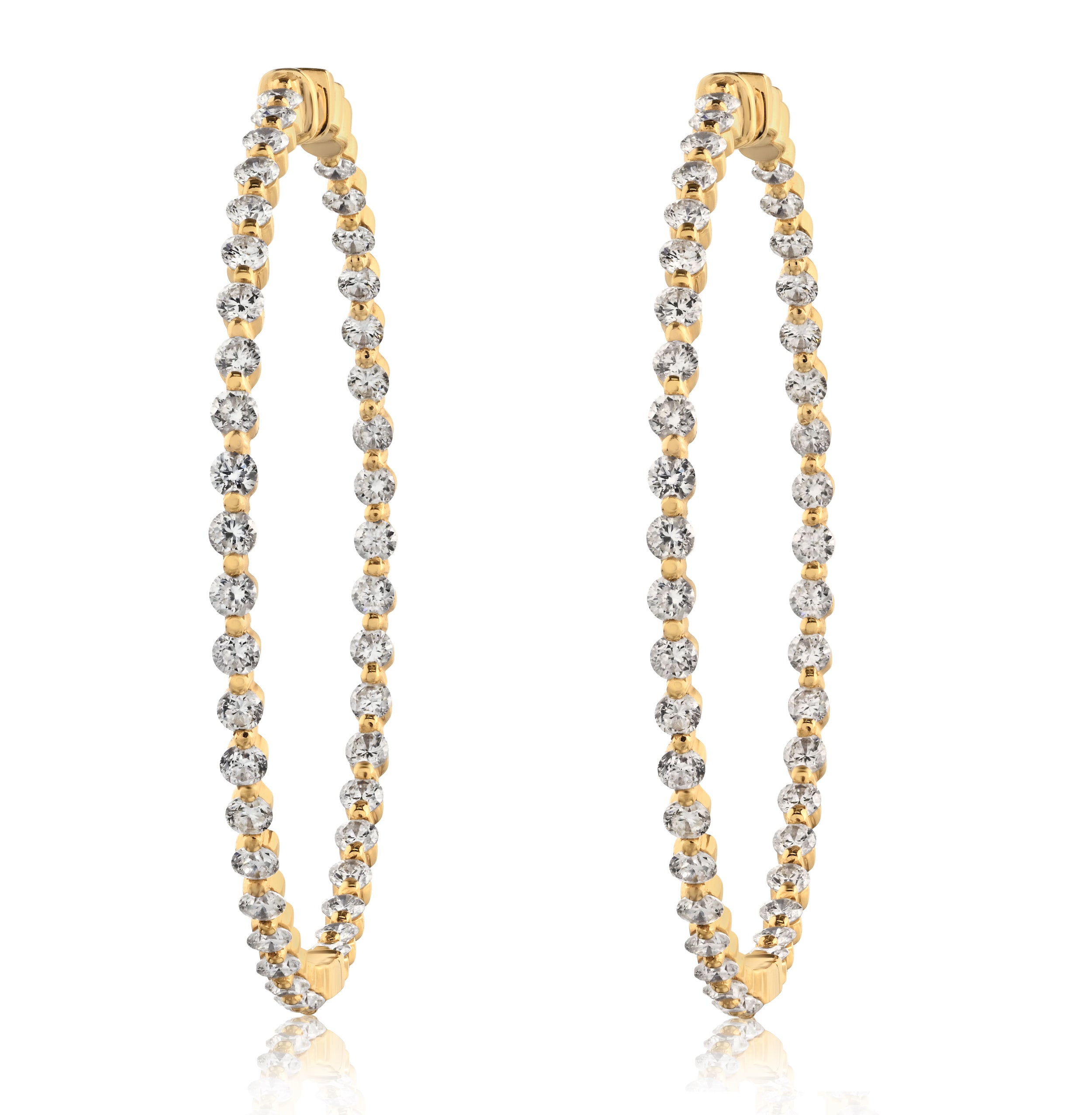 A pair of diamond hoop earrings with a gold band and round diamond embellishments.