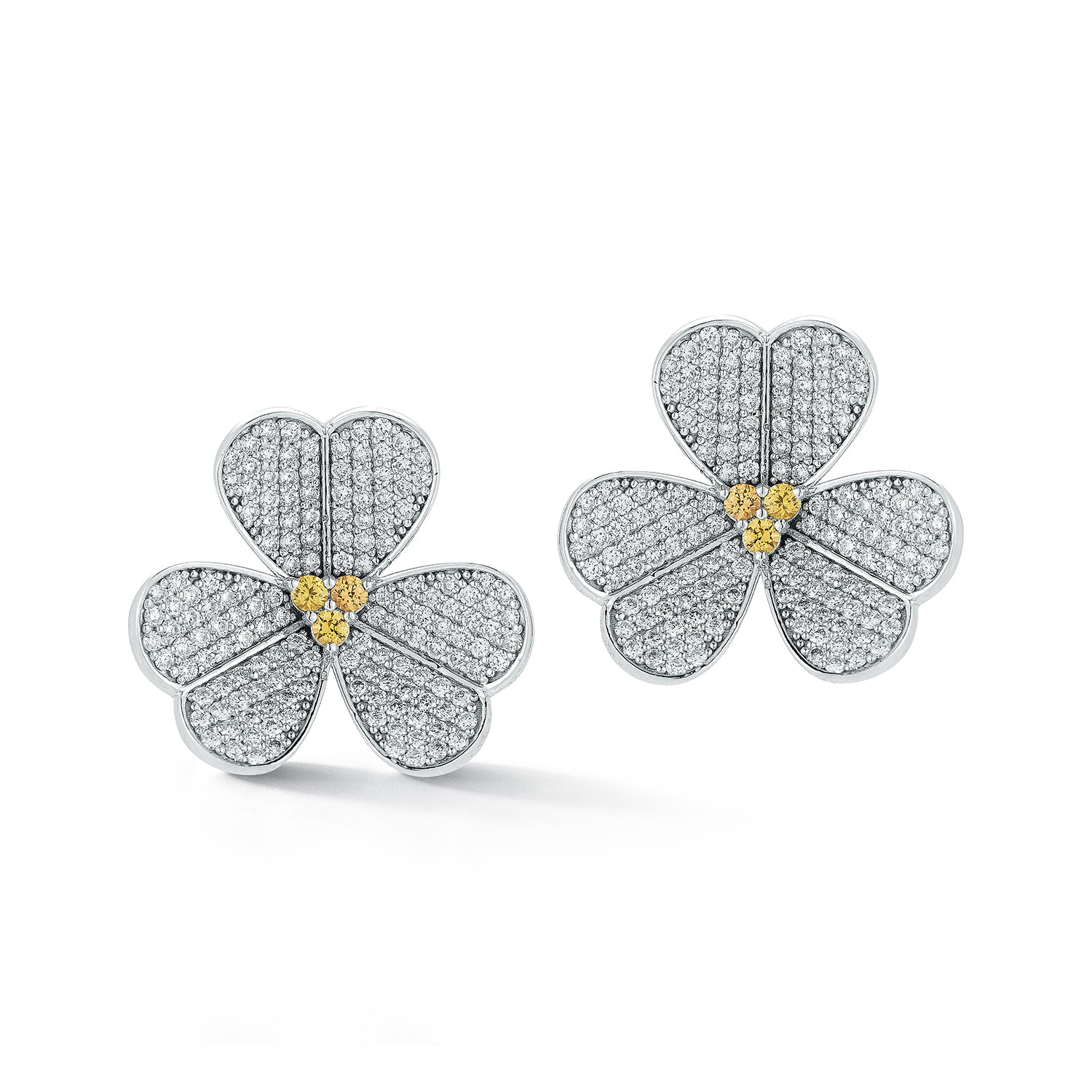 Flower-shaped earrings with diamond and gold accents on a white background