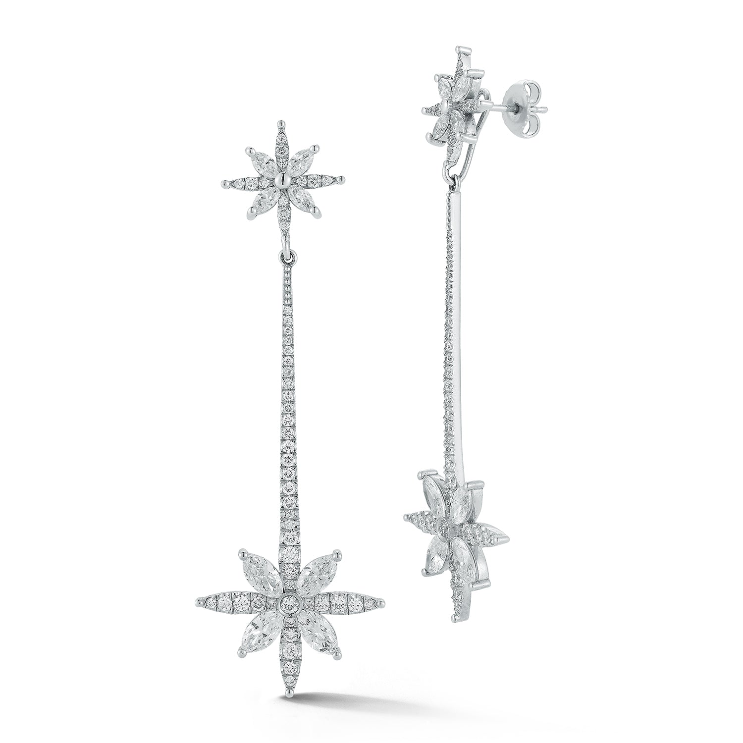 Star-shaped diamond earrings on a white background