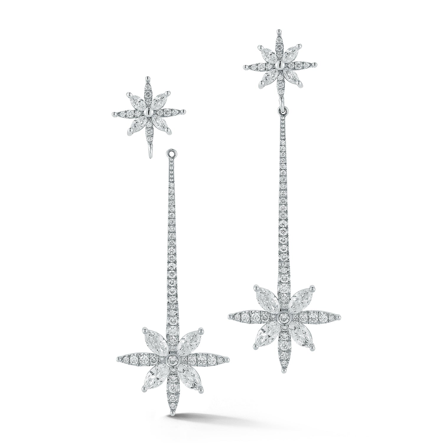 Star-shaped diamond earrings on a white background